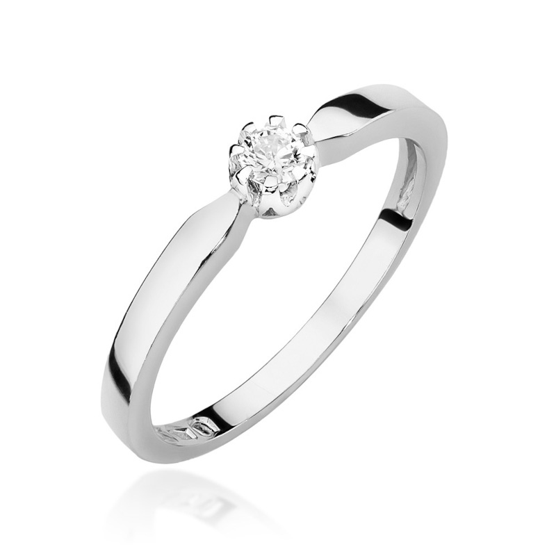 Klasyczny pierścionek zaręczynowy z diamentem o masie 0,10ct . Wykonany z białego złota.